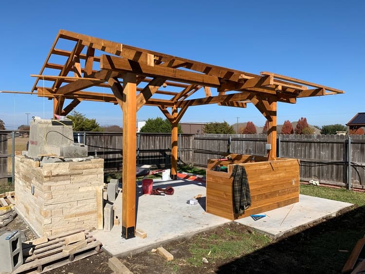 Covered patio structure and stonework.