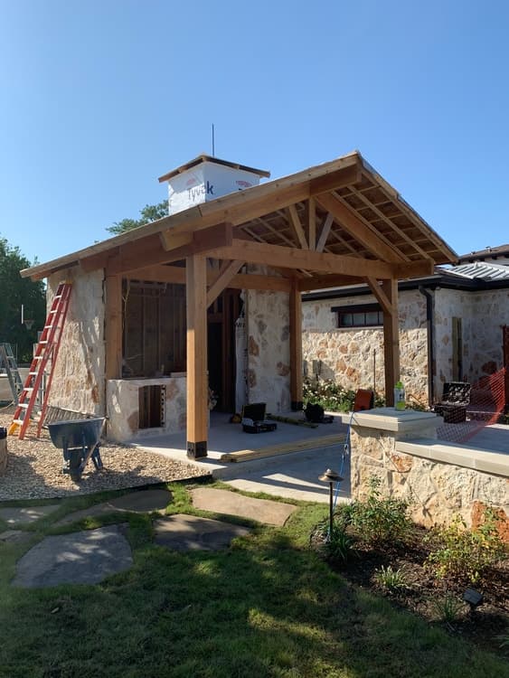 Structure, cabinetry and hardscape addition off an existing pool.