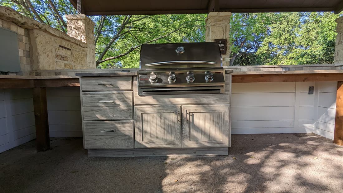 Custom outdoor kitchen and covered patio built by Outdoor Living in Texas in Waco
